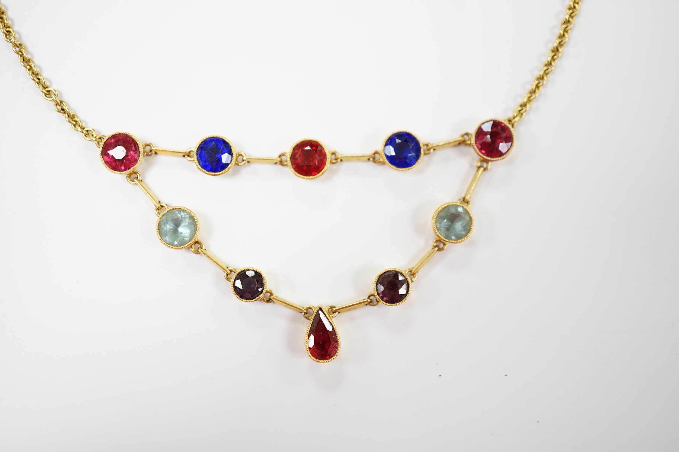 An early 20th century 15ct and ten stone multi coloured doublet set necklace, 49cm, gross weight 11.4 grams (the two pale blue stones appear not to be doublets?).